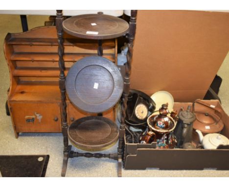 An early 20th century child's kitchen dresser, bowed cresting above three long shelves, the projecting base with two doors pr