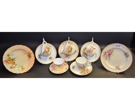 A set of four Royal Worcester cups and saucers, painted by George Hundley, with ferns and grasses, impressed marks, a similar