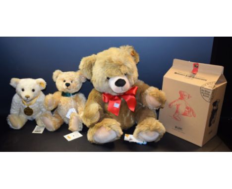 A Steiff Millennium bear, boxed, certificate; a Steiff Button in Ear bear, dust bag, certificate; a Steiff Cosy Friends bear,