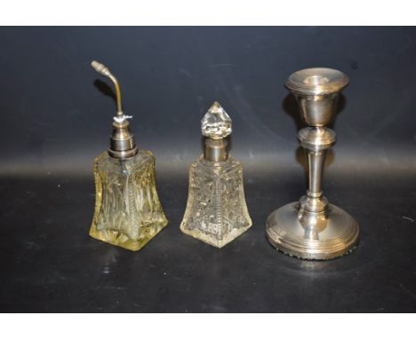 A silver dressing table candlestick, Birmingham 1918; a cut glass scent atomiser, the silver collar marked sterling; a cut gl