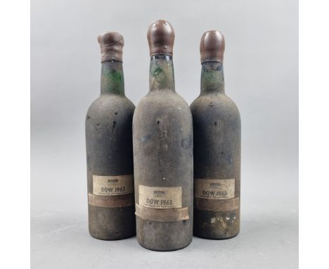 3 Bottles Dow's 1963 Vintage Port - Shipped by Grants of St James's   (Please note 2 Bottles signs of historical seep. All th