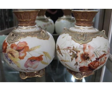 Two Royal Worcester porcelain vases of globular form, hand painted floral decoration, factory marks to base, includes number 