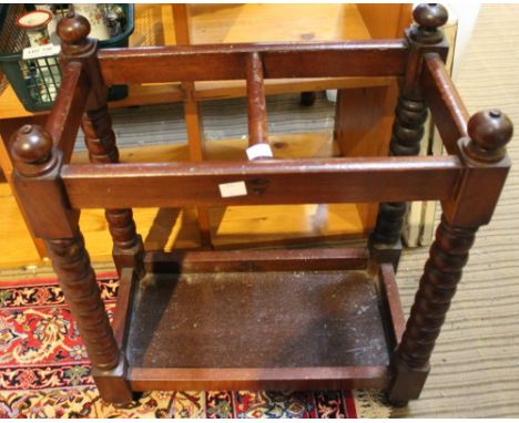 A stained wood stick stand, bobbin turned frame, 52cm high