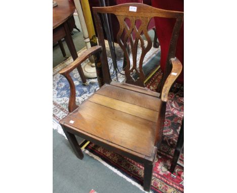 A 19th century oak country Chippendale design open armchair