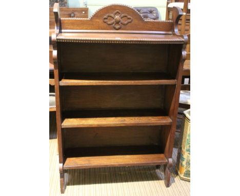 An open oak bookcase, the top shelf bow fronted with beaded edge&nbsp;