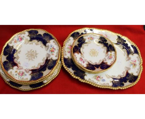 A collection of Coalport ceramic table ware, cobalt blue, floral painted and gilded, comprising dinner plate, three breakfast