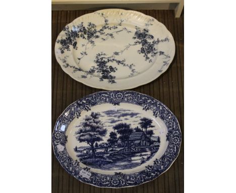 A large oval meat platter by Booths late 19th century, decorated with blue transfer printed swathes of roses on a white groun