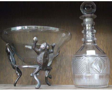 A 19th century decanter with stopper together with a glass bowl on frog stand