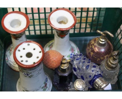 A collection of decorative glass scent bottles, two with silver tops, together with ceramic dressing table items