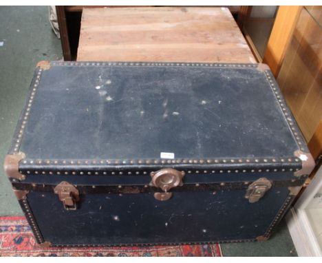 A large wooden trunk, together with a blue example