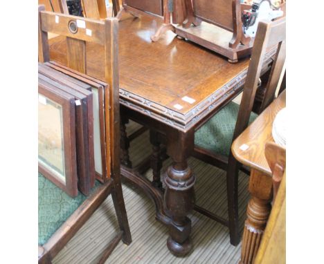 An Elizabethan design, oak draw-leaf dining table, with decorative edge, raised on cup &amp; cover supports with cross stretc