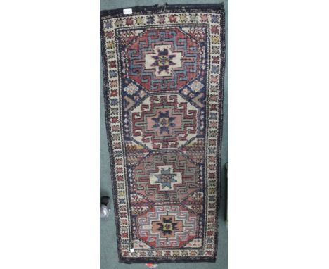 A Persian design wool rug, geometric decoration, 137cm x 56cm