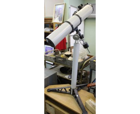 An Amateur Astronomer telescope on tripod stand