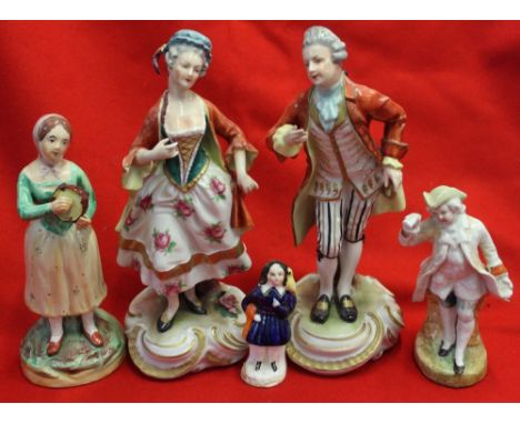 A pair of Continental ceramic figurines in 18th century costume, together with three 19th century Staffordshire figures (5)