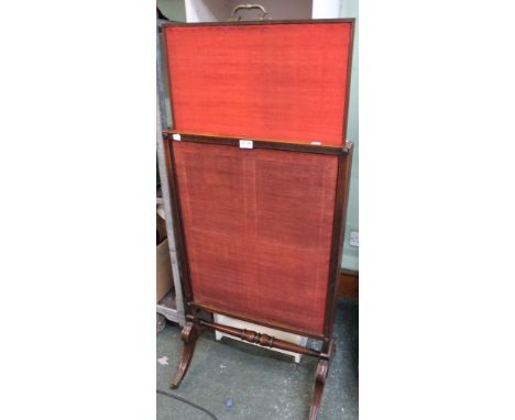 A 19th century mahogany framed adjustable fire screen