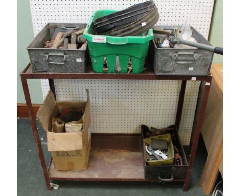 A metal bench containing a selection of engineering tools &amp; equipment