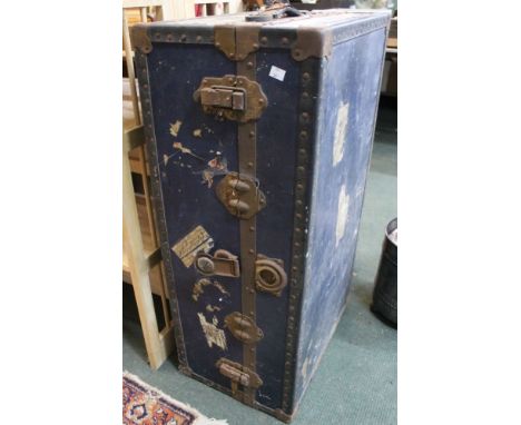 A blue metal bound vintage travel trunk