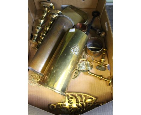 A quantity of brasswares, candlesticks, shell case fire tool holder, horse brasses, etc