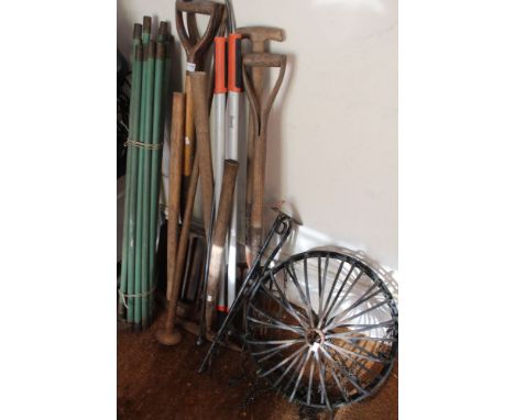 A selection of garden tools together with hanging baskets