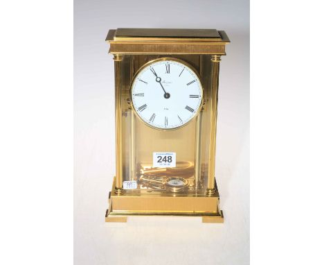 Rapport of London brass and glass mantel clock with enamel dial.
