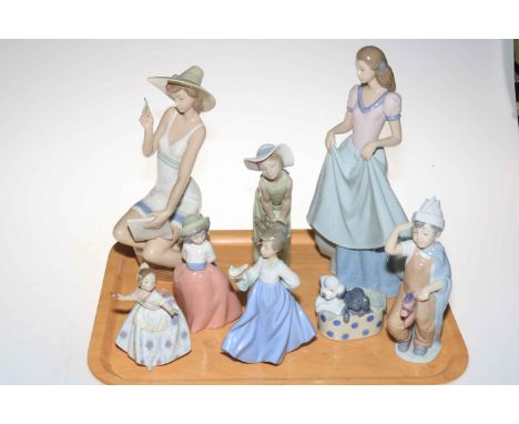 Six various Nao figures and two Lladro lady figures.