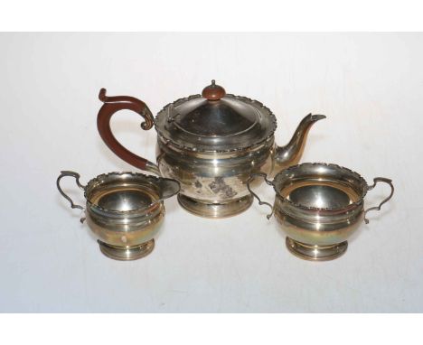 Silver three piece tea service with shaped rims, Birmingham 1927.
