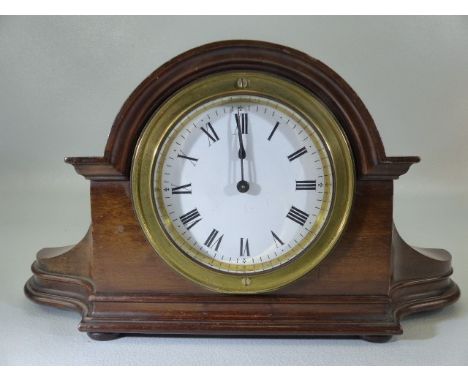 Antique miniature mantle clock (mahogany) with enamelled face and Roman Numeral Chapter ring. Clock appears to be working.