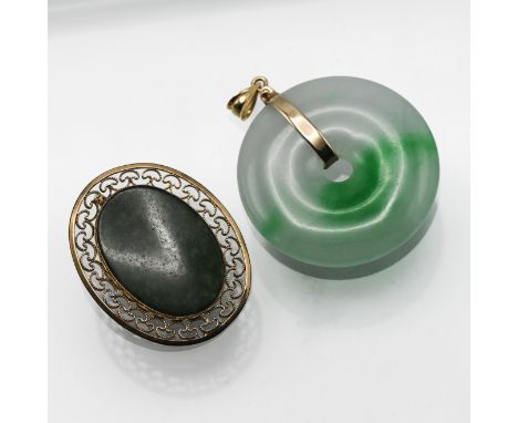 A 14k gold circular jade pendant together with a jade brooch.