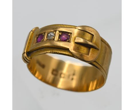 An 18ct ruby and diamond set buckle ring, approx 4.40g, size N.