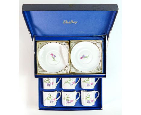 Boxed Shelley coffee cans and saucers, pattern 857 in original box. 