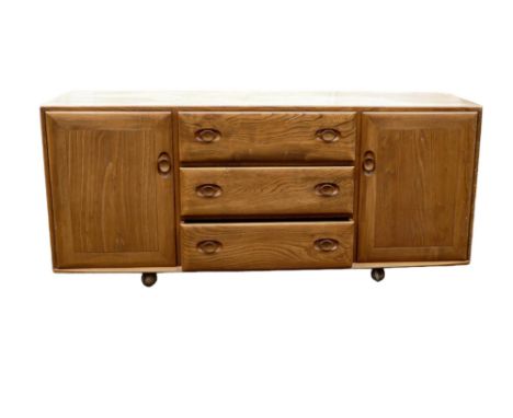 Late 20th century Light coloured Ercol two door three drawer sideboard, length 156cm, depth 43cm &amp; height 68cm 