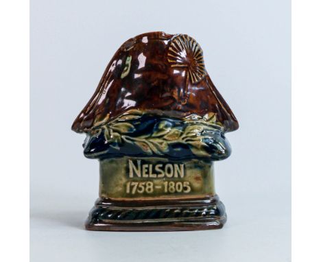 Royal Doulton Stoneware commemorative Admiral Lord Nelson candlestick, modelled as his hat and laurel wreath resting on a blu