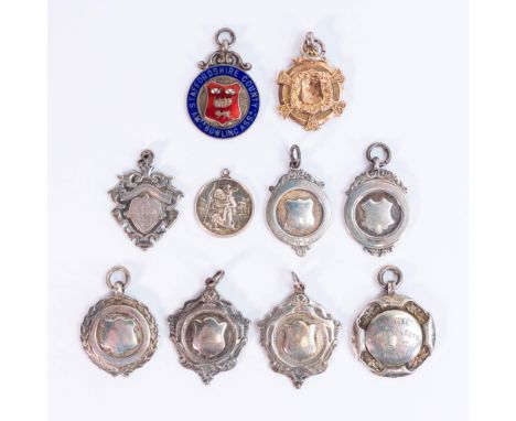 A good collection of silver shield medals including enamelled Staffordshire County Bowling badge, gold on silver badge etc., 