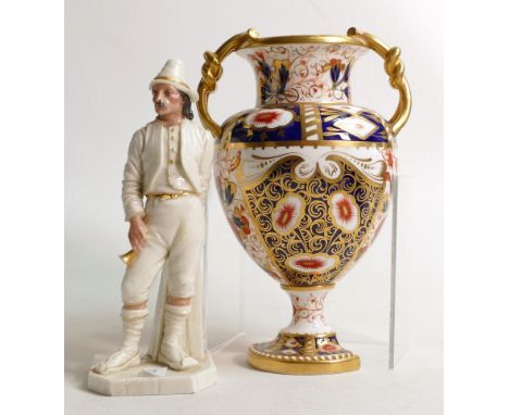 Royal Worcester figure of a man holding a horn and a Davenport two handled Imari urn, both of these items have extensive dama