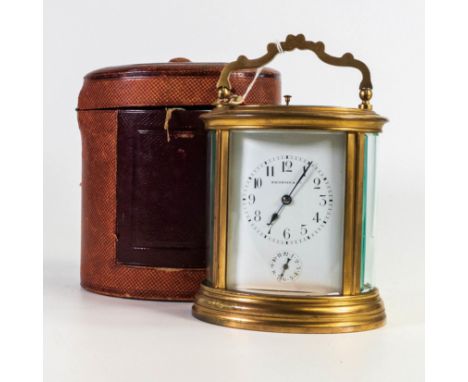 Fine 19th century Italian oval brass oversize Carriage Clock, with repeat and alarm function, complete with original leather 