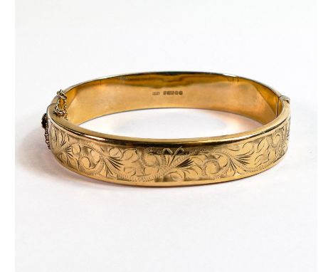 9ct gold ornate floral decorated bangle, 15.7g. 
