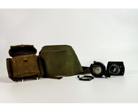 1941 MKIII British Prismatic Marching Compass, similar damaged item together with two related canvas bags. (2) 