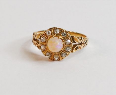 18ct gold ring set with central opal surrounded by 10 diamonds, 3.6g. Ring size R