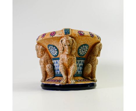Amphora Pottery planter decorated with four decorative dog Caryatids. 