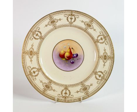 A Royal Worcester cabinet plate by Townsend, painted with a still life of fruit with gilt border, printed puce factory mark, 