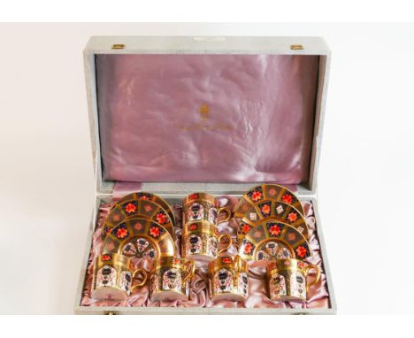 Royal Crown Derby 1128 Imari set of coffee cups and saucers, red backstamp, in silk lined presentation box. (12) 