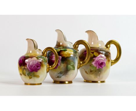 A graduated set of Royal Worcester gilded ewers, painted with roses, the larger one signed Austin and small one signed by M H