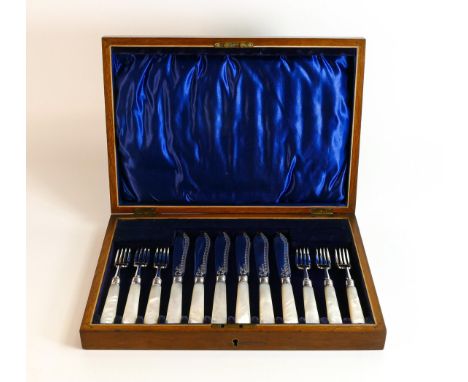 A quality ornate silver set of knives &amp; forks with mother of pearl handles, hallmarked for Sheffield 1922, in wooden case