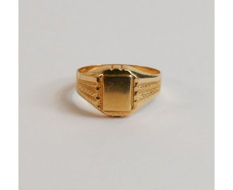 Yellow coloured metal signet ring, tested as about 18ct, ring size Q, weight 2.25 g. 