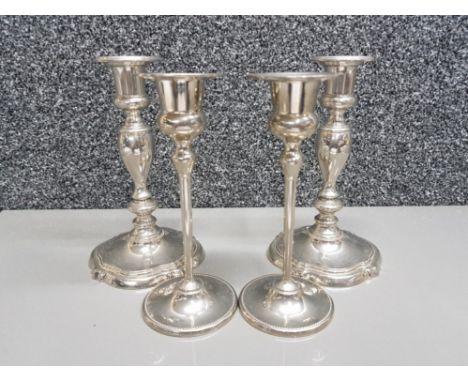 Pair of silver plated Lanthe of England candlesticks together with a further pair of silver plated candlesticks by M&amp;R