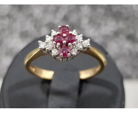 Ladies 18ct gold Ruby and diamond cluster ring. 3.1g size N1/2