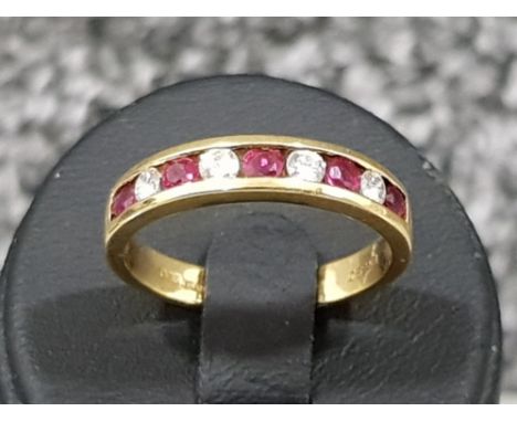 Ladies 18ct gold Ruby and diamond 9 stone band. 3.1g size M