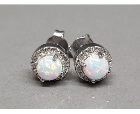 A pair of silver and cz and opal studs 2.63g gross