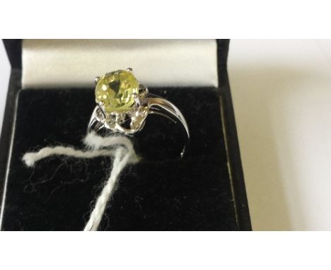 A Silver Ladies Yellow Gem Set Ring.  Size K 1/2.