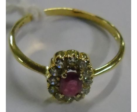 A 18ct Diamond and Ruby Cluster Ring.